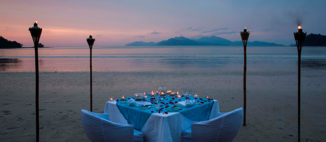 Private dining on Top 10 beach in the world with jungle backdrop